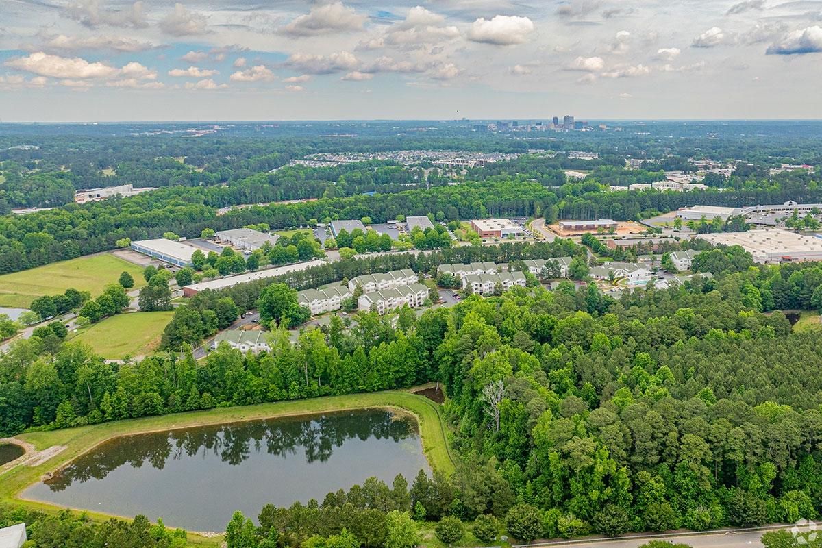 Apartment buildings are bordered by trees and ponds in South Raleigh.