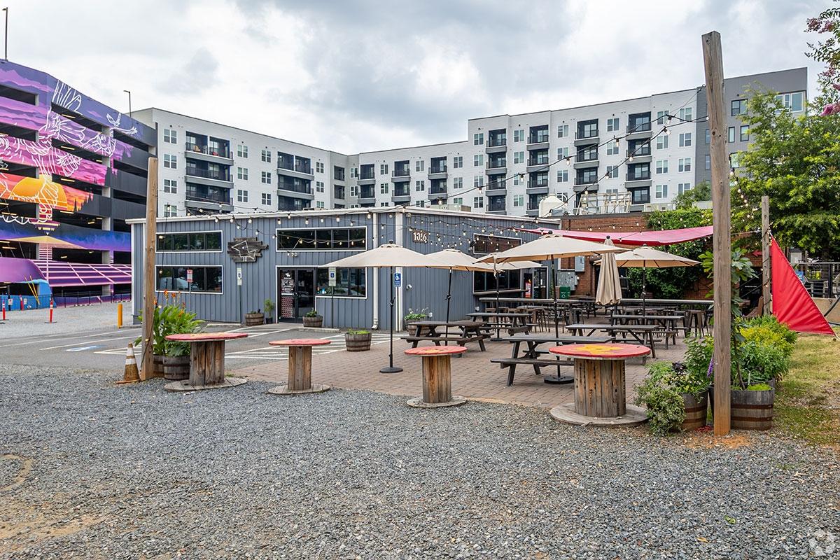 Brewery sits behind modern apartment building in Belmont.