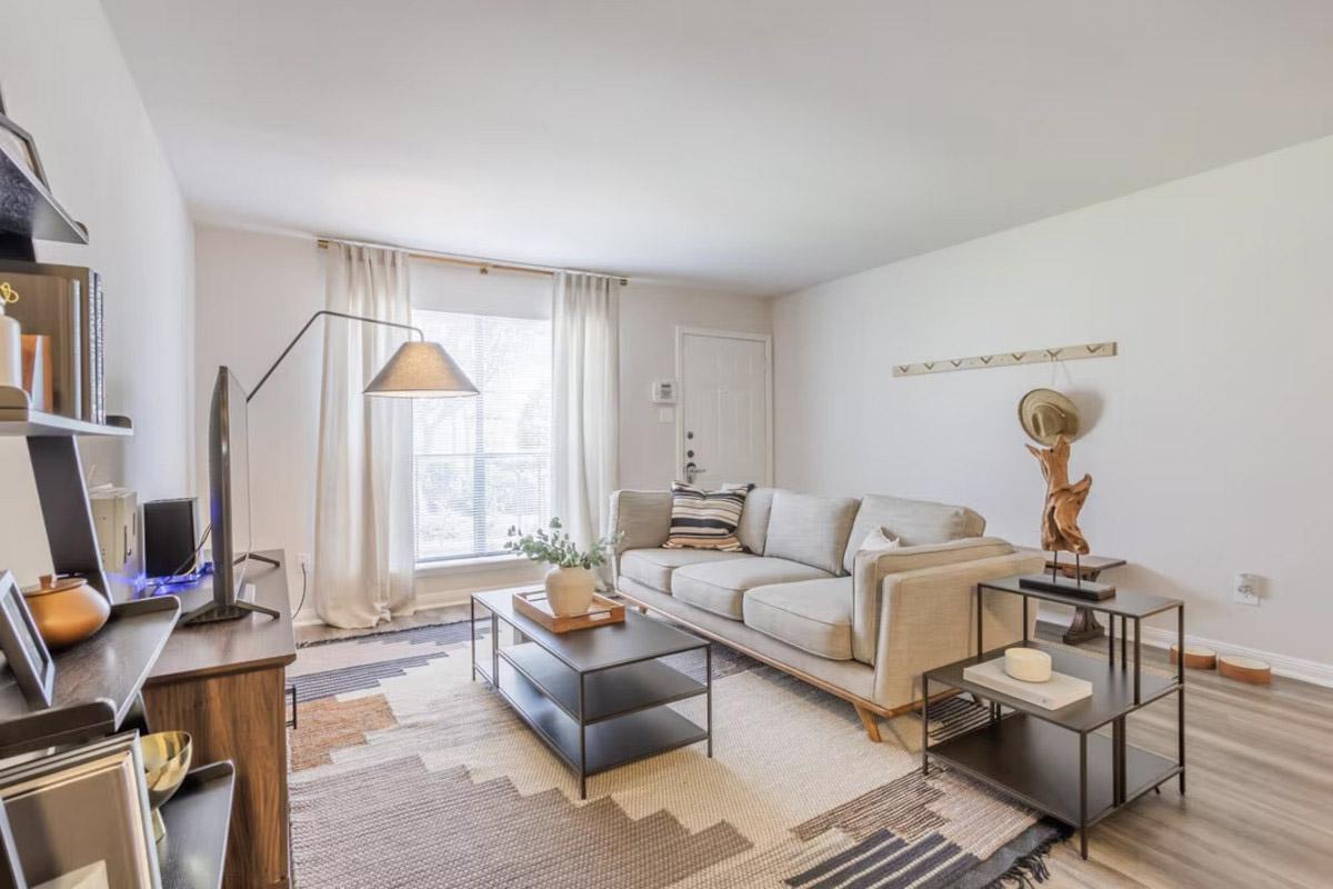 A cozy living room in a unit at the Pavilion Place apartment community in Gulfton.