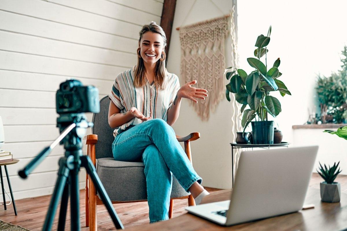 A renter recording a video on her balcony