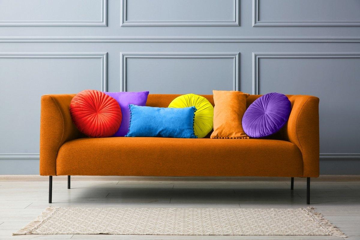 A colorful sofa with brightly colored pillows