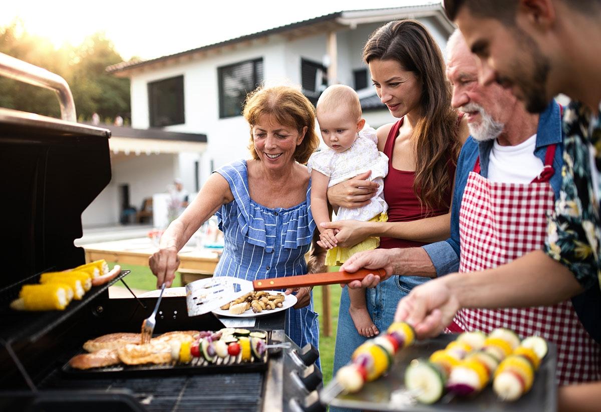 Renter using a community grill for a Father's Day barbeque.
