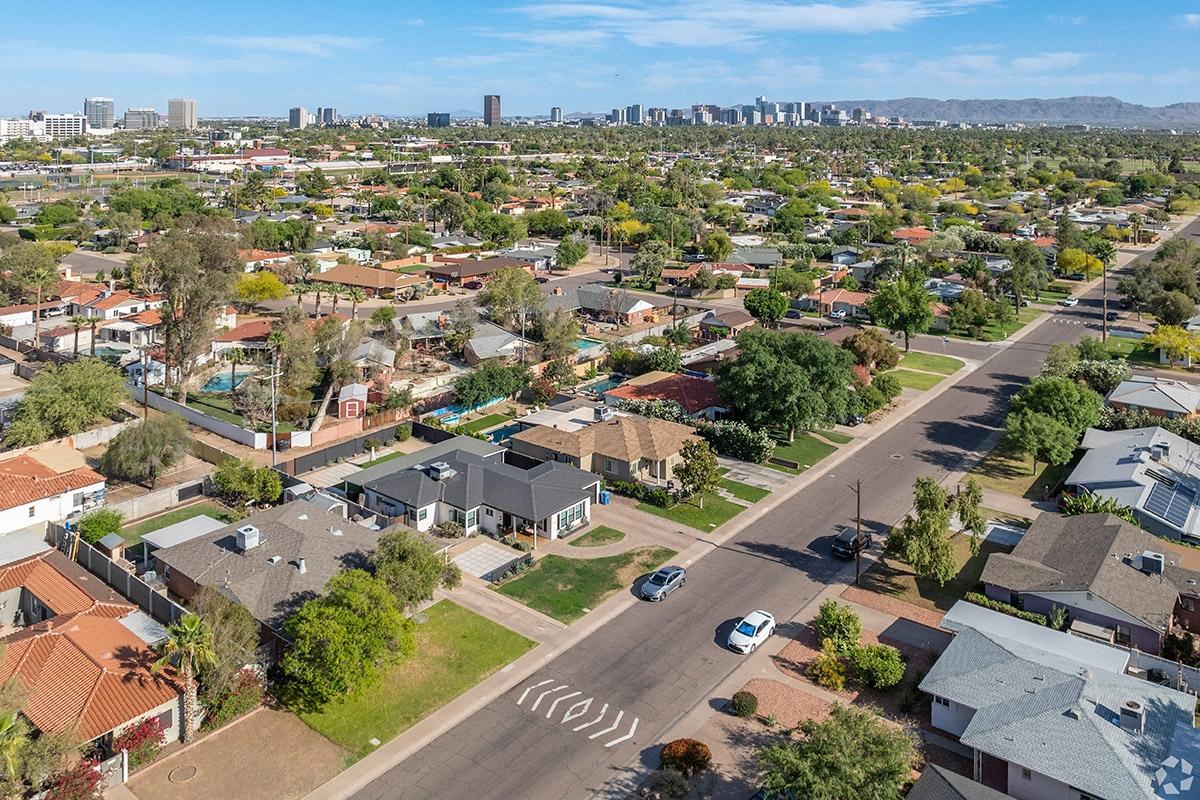 Single-family homes fill Encanto while Downtown Phoenix can be seen in the background.