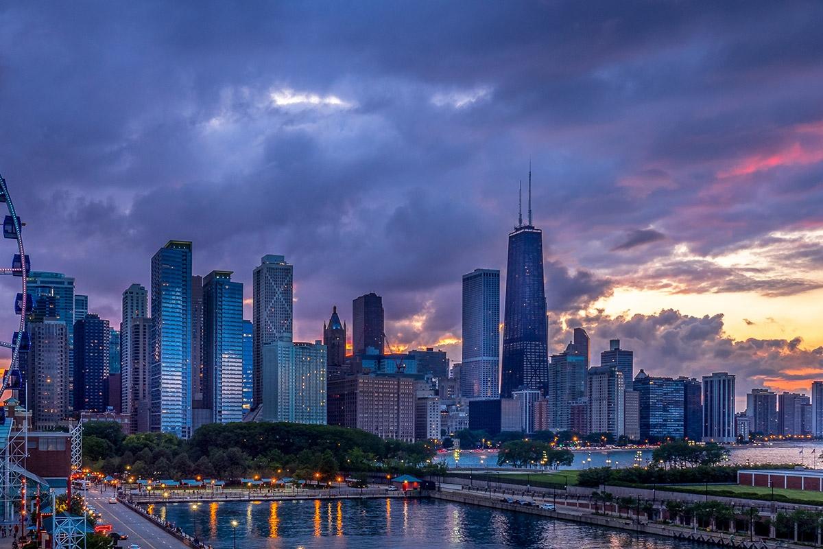 Chicago's skyline stands tall as the sun sets.