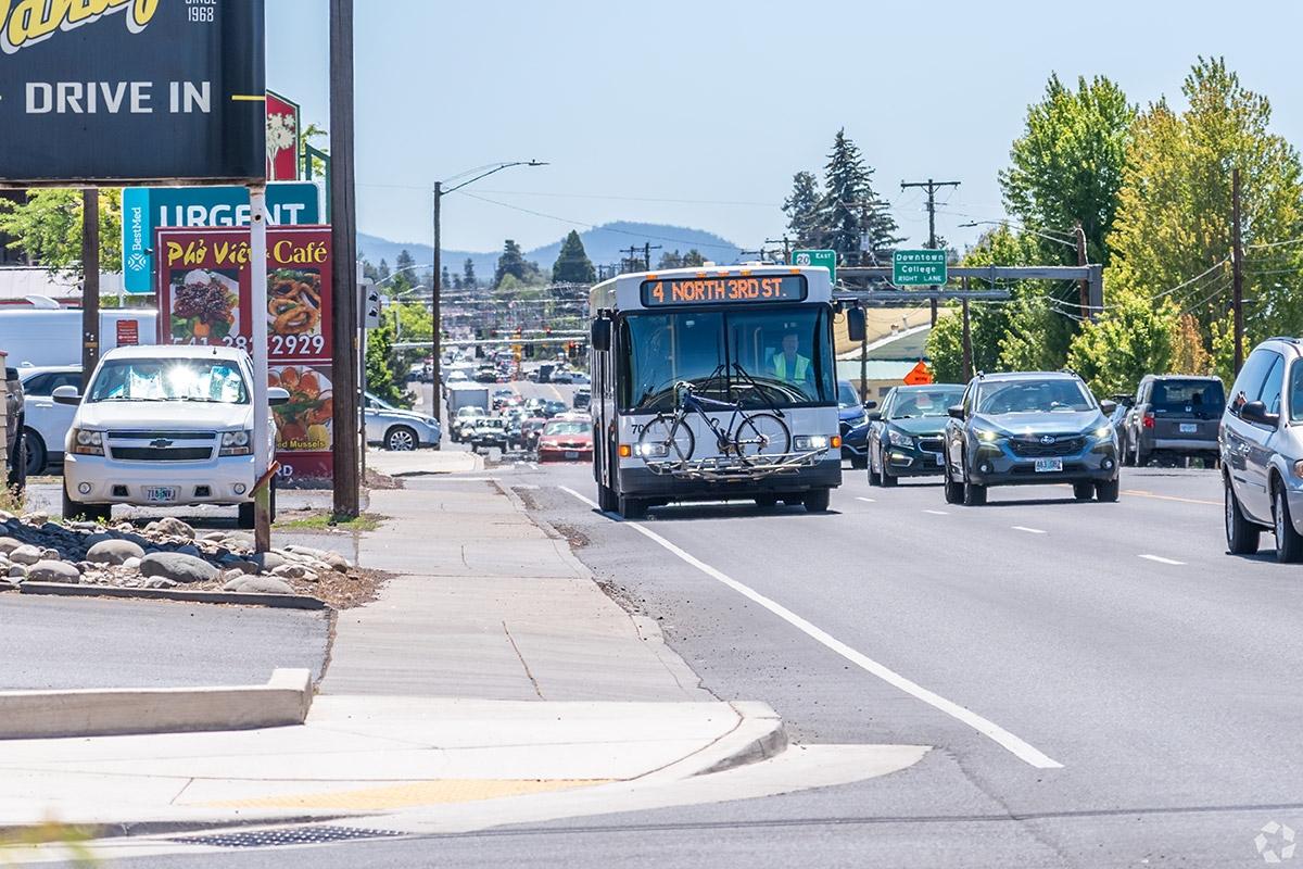 A bus in a smaller Oregon city, displaying the limited public transit options.