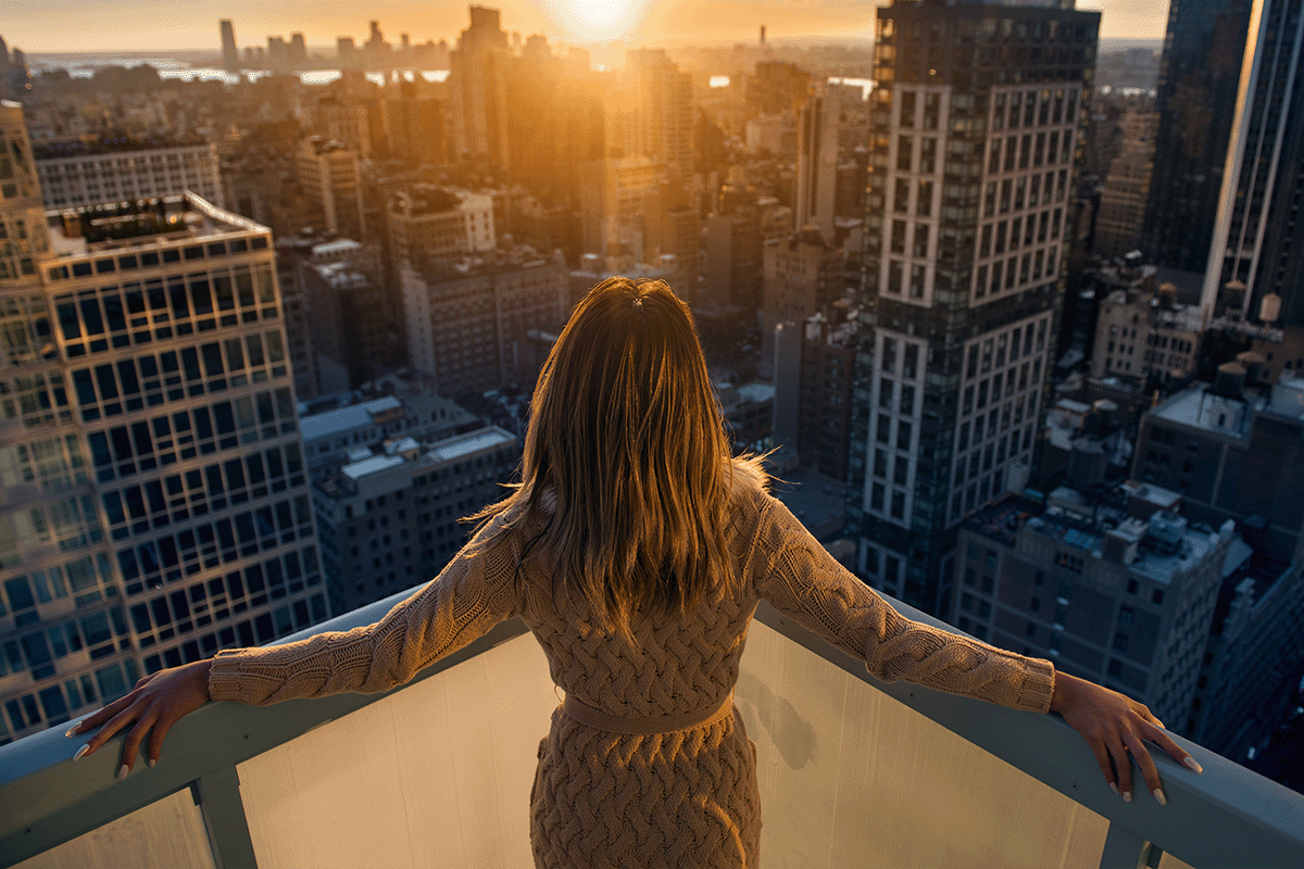 Renter looking out her balcony