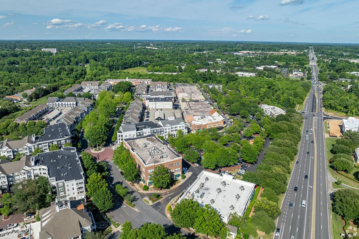 Huntersville has mixed-use spots clustered between trees.