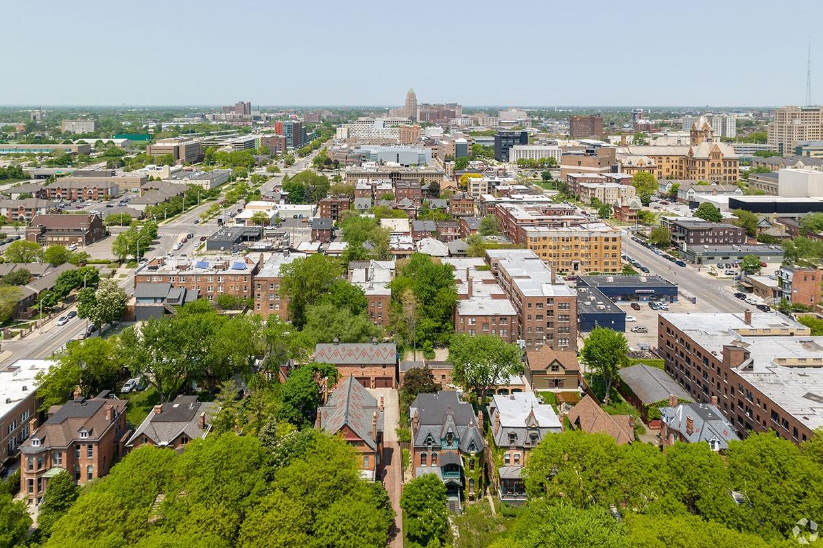 Midtown Detroit is a compact neighborhood where apartment communities sit right next to each other, with a few trees on the streets.