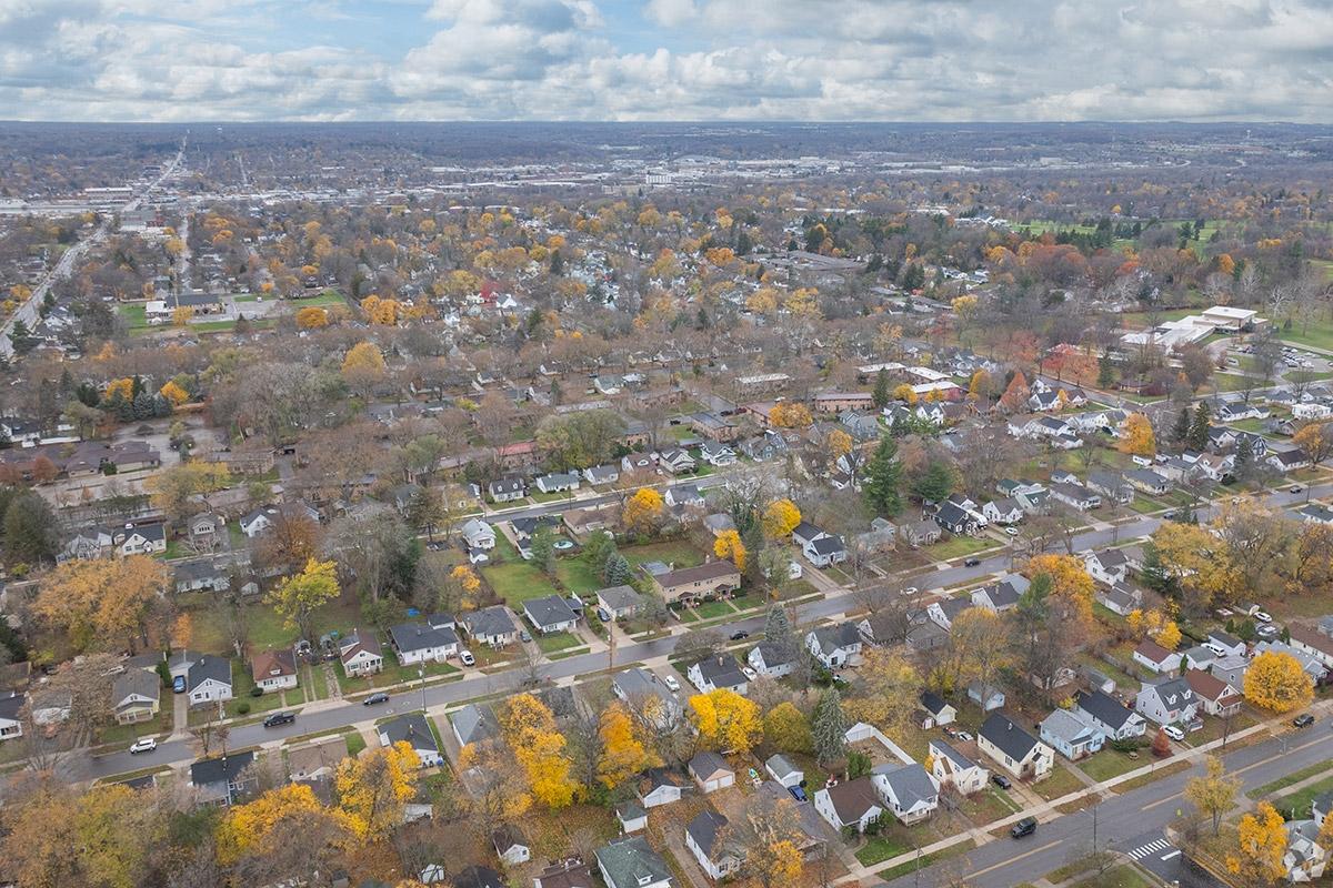 Trees burst into color during fall from where they fill the lawns of homes in Northeast Grand Rapids.