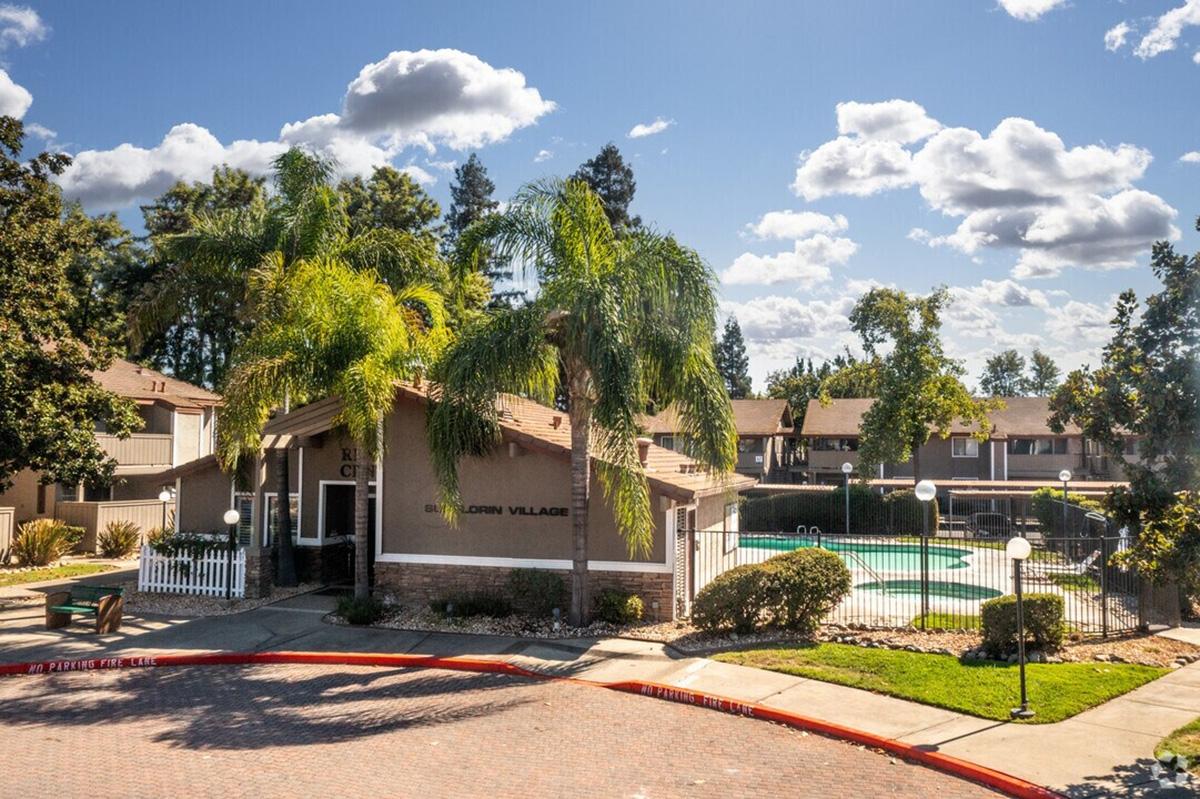 A view of the clubhouse and pool at the Sunflorin Village apartment community in Florin.