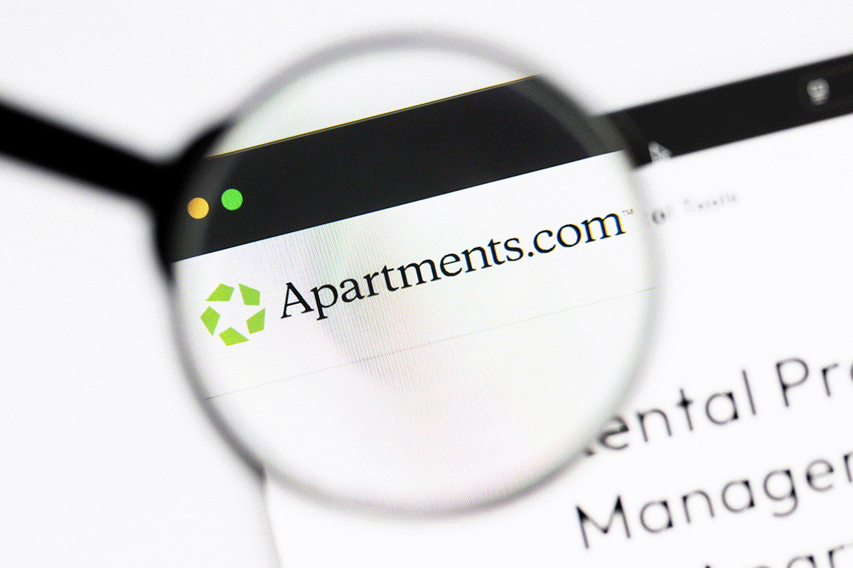 Apartments.com Logo Under Magnifying Glass