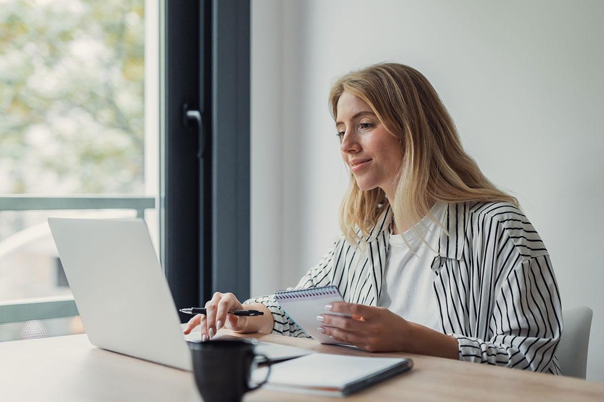 Woman on her laptop attempting to organize an event.