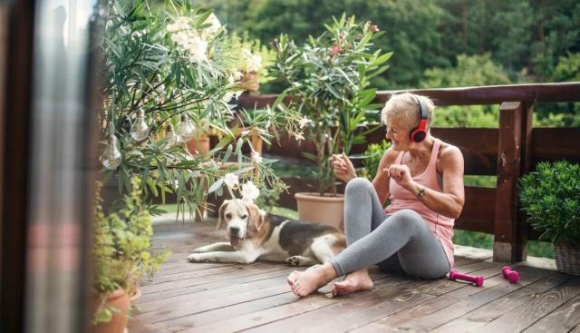Woman on Terrace with Dog