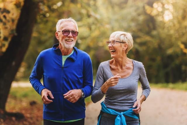 Senior couple taking a brisk walk in a park