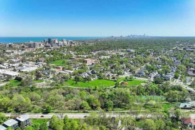 Evanston spreads out in neighborhoods and green spaces with Chicago in the distance.