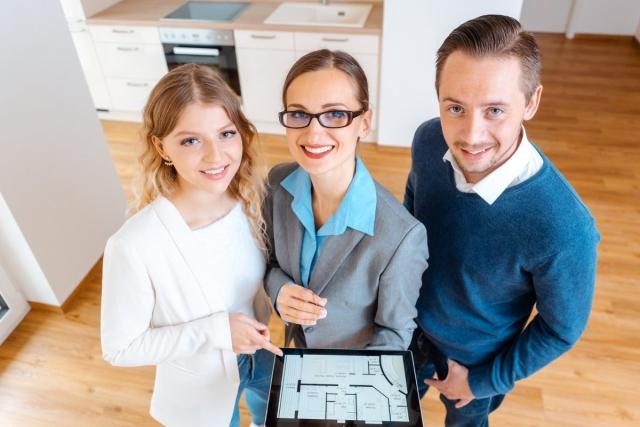 Renters touring an apartment with a leasing agent