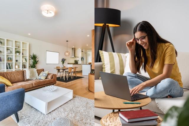Modern apartment next to woman sitting on couch on laptop.