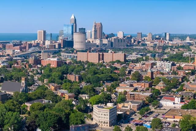 The Cleveland skyline rises in front of Lake Erie.