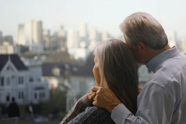 Retired couple looking out to San Francisco Row Homes