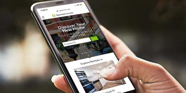 Using a mobile phone to search for an apartment.