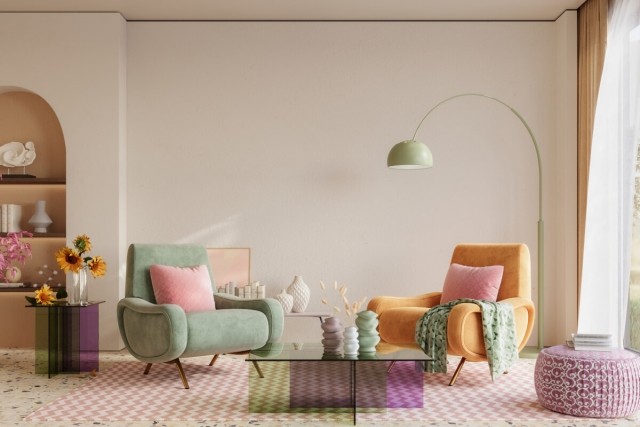 A colorful living room shows mismatched chairs on a chevron rug.