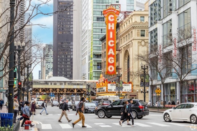 Photo of people walking through the Chicago metropolitan area. 
