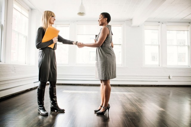 Renter shakes hands with broker.