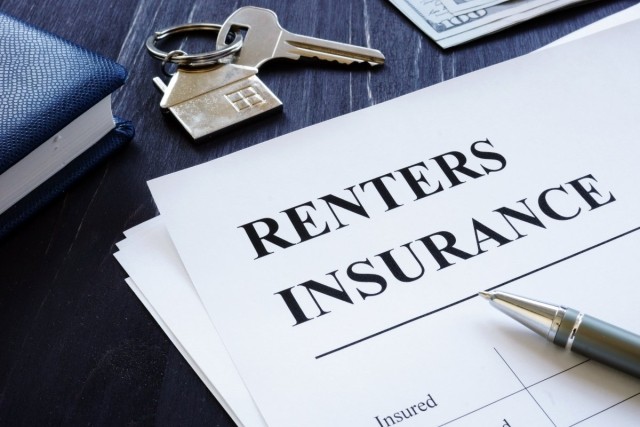 Pen sitting on top of paper about renters insurance.