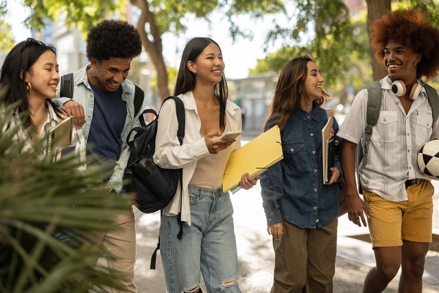 Photo of college students walking around campus.