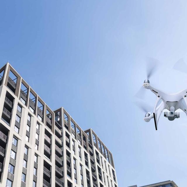 Drone flying amid apartment buildings