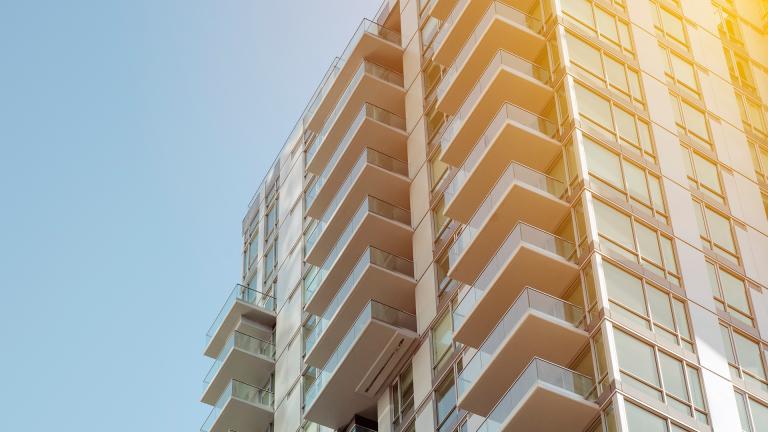 A view of apartment balconies from below