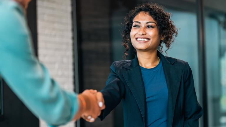 Renter and leasing agent shaking hands