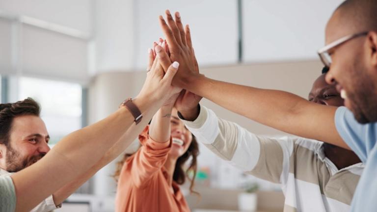 Team giving each other high-fives