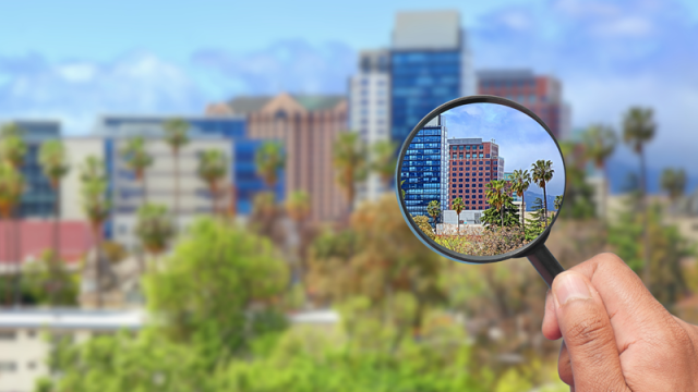 Magnifying glass focusing in on building in San Jose, CA