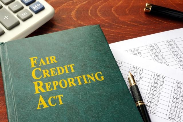 A copy of the Fair Credit Reporting Act sits on a desk.
