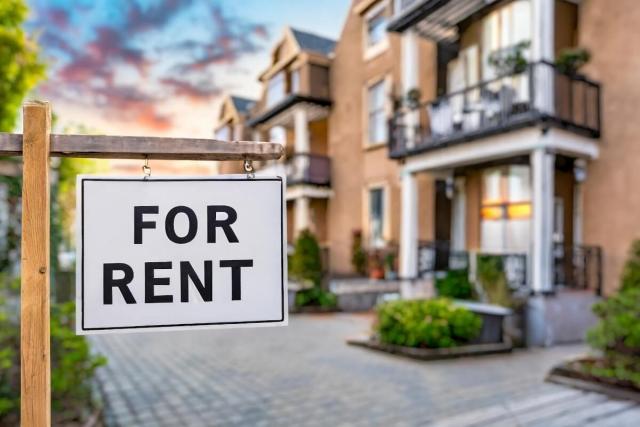 Rental property with 'For Rent' sign out front.