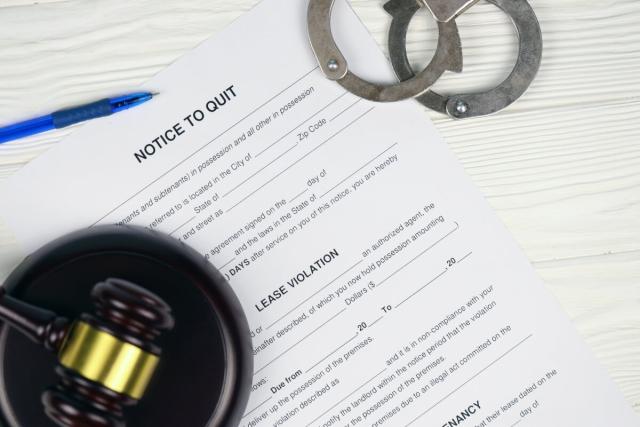 Lease violation letter on top of table.