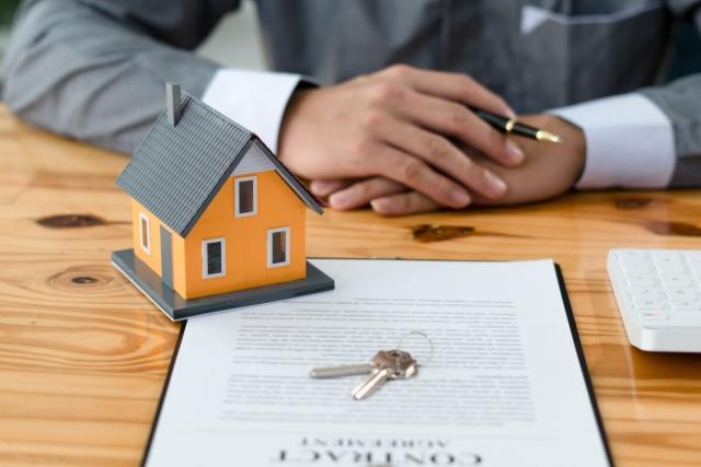 Tenant signs a renter insurance policy document. 