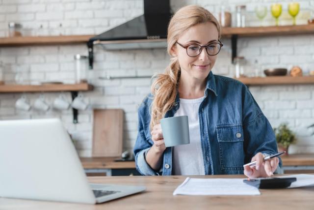Landlord Computing Finances at Work Desk