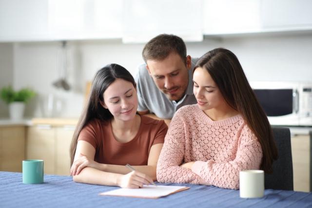 Cosigners signing lease together.