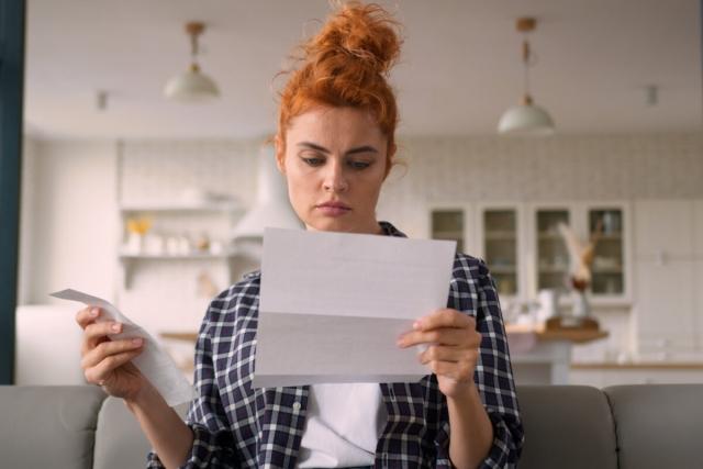 Tenant reads letter from her landlord.