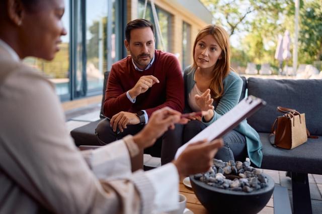 Landlord goes over rental agreement with tenants.