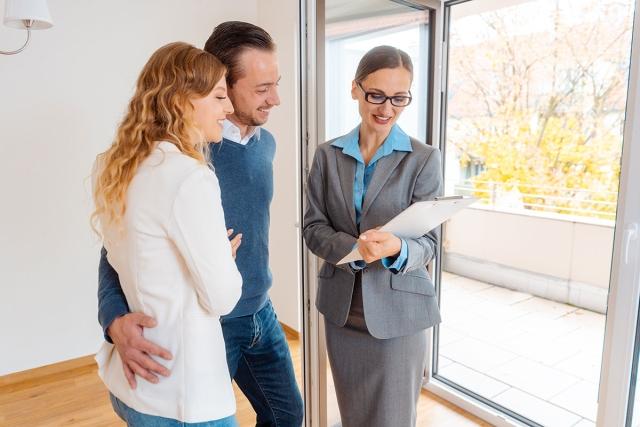 Landlord showing couple an apartment.