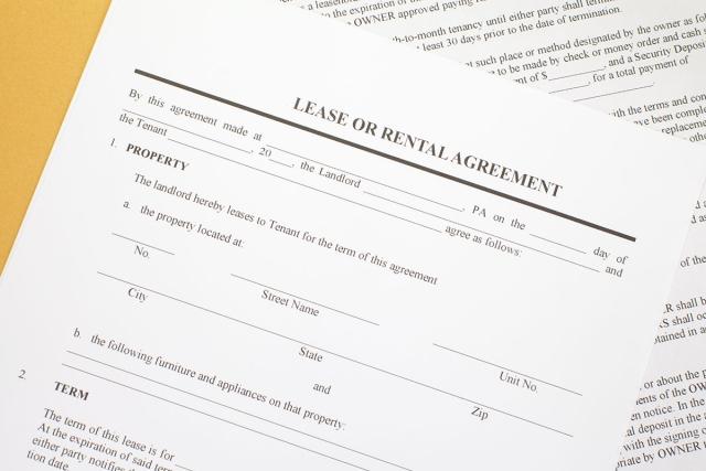 An example lease agreement sitting on a table.