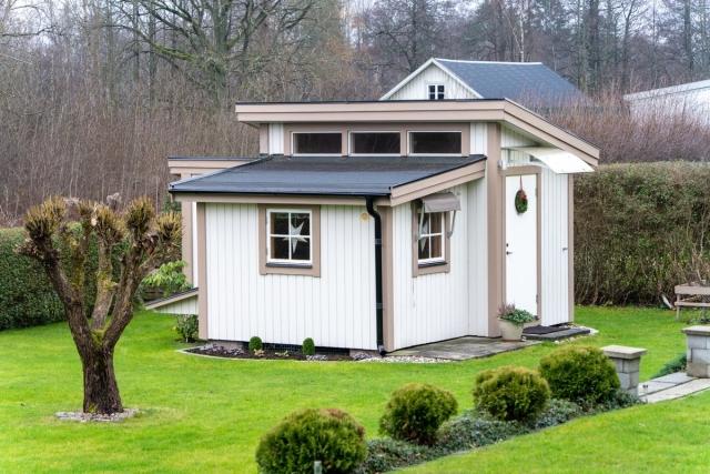 A small guest house in the backyard of a home