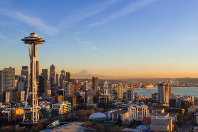 The Space Needle rises above Seattle in the morning light.