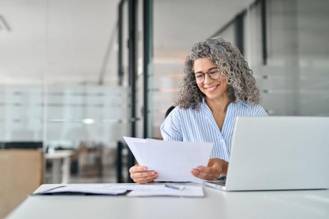 Landlord reviewing renter applications to make a decision