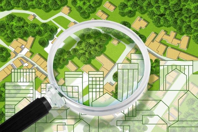 A map of a neighborhood with a magnifying glass sitting on top