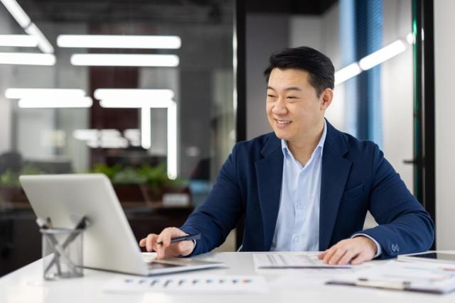 Landlord creating rent receipts on his laptop