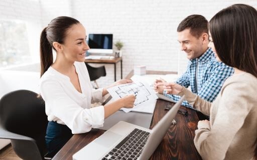 Property manager discussing plans with prospective renters